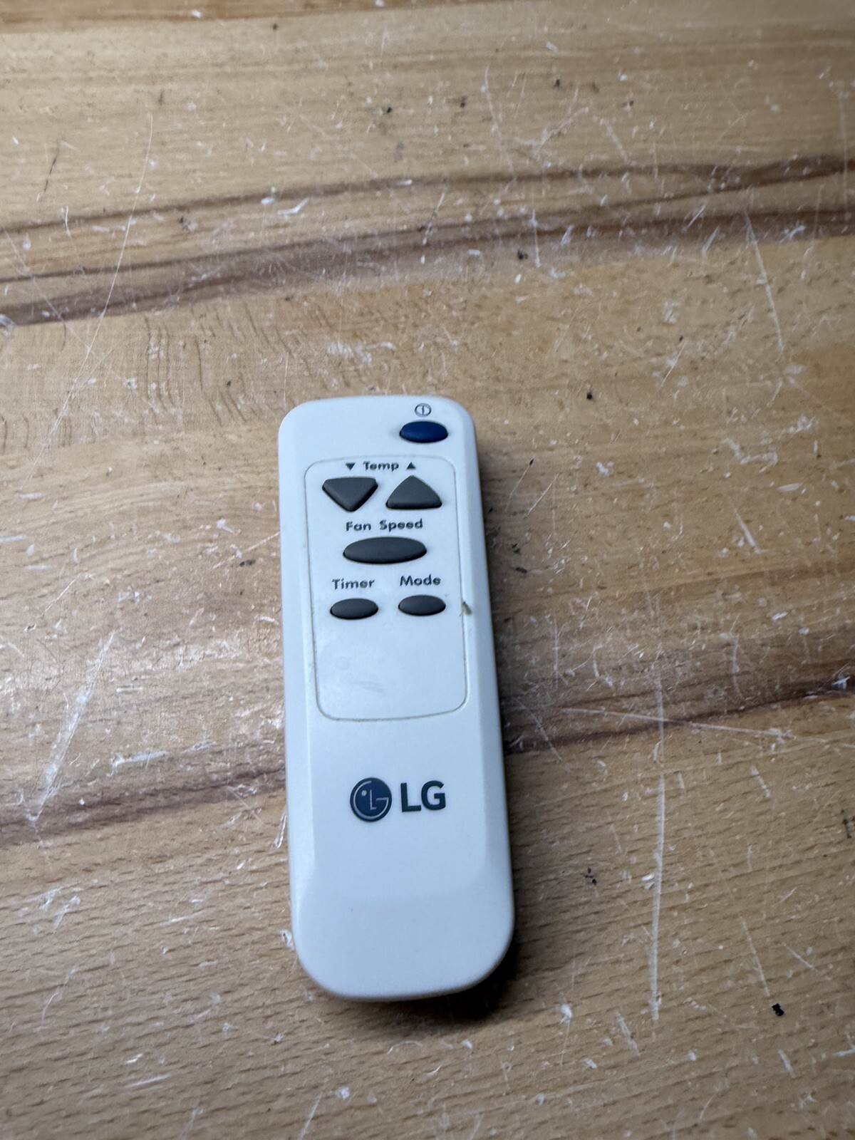 (A) LG Window Air Conditioner Remote. Model Number AKB73016012